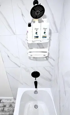 a white bathroom with a sink and toiletries at A Cozy Home away from Home in Edmonton