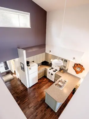 an overhead view of a kitchen with white appliances at Island Vista - Waterfront Condo in Tofino