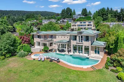 an aerial view of a large house with a swimming pool at Spectacular, Water View House! Property overview! in West Vancouver