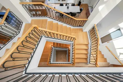 an overhead view of a spiral staircase in a house at Spectacular, Water View House! Property overview! in West Vancouver