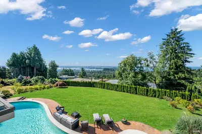 an estate with a swimming pool and a lawn at Spectacular, Water View House! Property overview! in West Vancouver