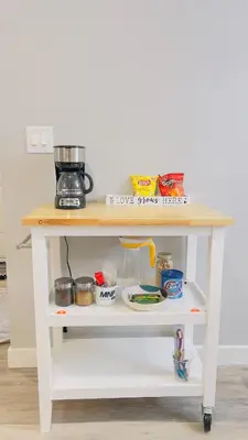 a white table with food on a shelf at Calgary Airport Stay Private Suite 1Bed in Calgary