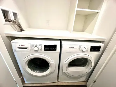 a laundry room with two washer and dryer at Stylish 1B1B locates in the heart of Richmond in Richmond
