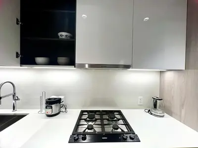 a kitchen with a stove top in a kitchen at Stylish 1B1B locates in the heart of Richmond in Richmond
