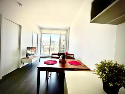 a room with a table with red mats on it at Stylish 1B1B locates in the heart of Richmond in Richmond