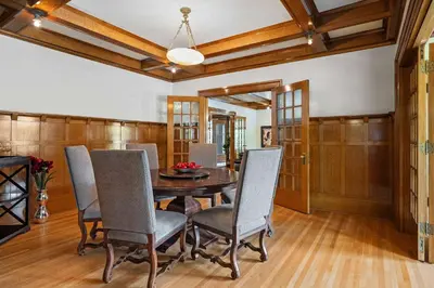 a dining room with a table and chairs at Historic Treend Residence in the heart of Mission Calgary in Calgary