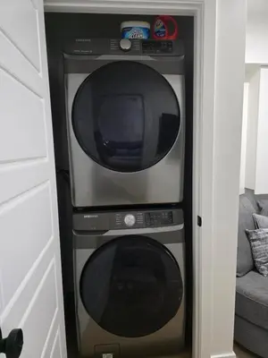 a microwave and a oven in a room at Amaville- The Cozy Cave - Minutes to WEM & YEG in Edmonton