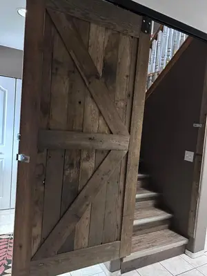 an open wooden door with stairs in a house at Golden Ears Serenity in Maple Ridge District Municipality