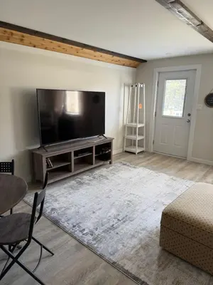 a living room with a large flat screen tv at Beach Bed and Breakfast in Grand Forks