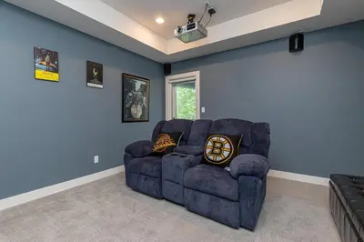 a living room with a couch and blue walls at Come On In, The Water View Is Waiting For You,,, in Oak Bay