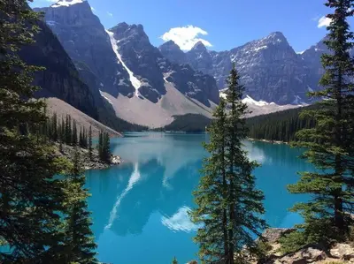a view of a blue lake with snow capped mountains at Pyrenees #202 - LEED Gold Certified in Canmore