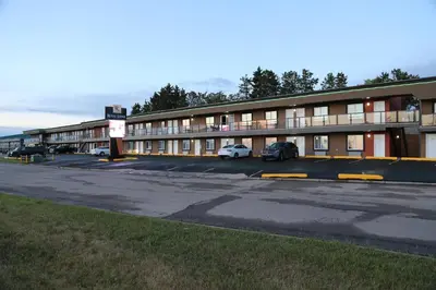 an empty parking lot in front of a hotel at Royal Lodge in Edmonton