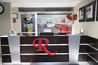 a bar with a red logo on it in a room at Royal Lodge in Edmonton