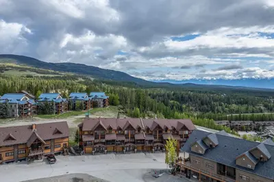 an aerial view of a lodge with mountains in the background at Timberstone Lodge by StayIn in Kimberley