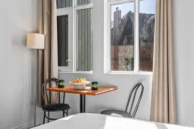a room with a table and chairs and a window at Chic Mountain Hideout in Canmore DT Near Banff! in Canmore