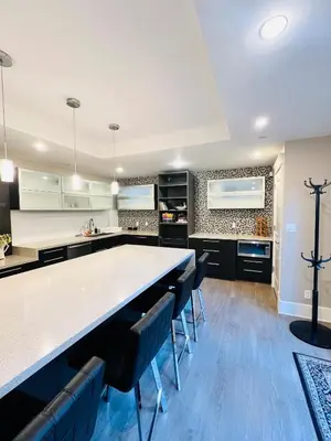 a large kitchen with a large table and chairs at 3Bed 2Bath Steam Sauna Retreat! Family friendly! in Vancouver