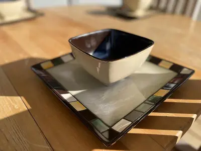 a bowl sitting on a plate on a table at Private Luxury Relaxing HOME w BBQ & Gas Fire-pit in Hope