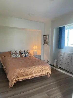 a bedroom with a large bed and a window at Private Luxury Relaxing HOME w BBQ & Gas Fire-pit in Hope