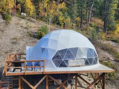 a dome tent is sitting on a wooden deck at Alpenrose Dome Hottubs Mountains view sleep 4 in Golden