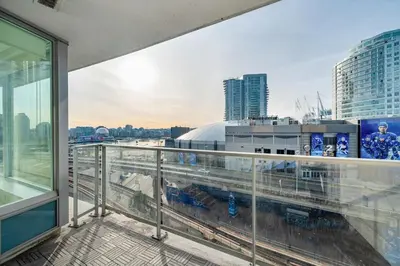 a balcony with a view of a city at Bright 3BR Downtown Vancouver Condo w Pool & Gym in Vancouver