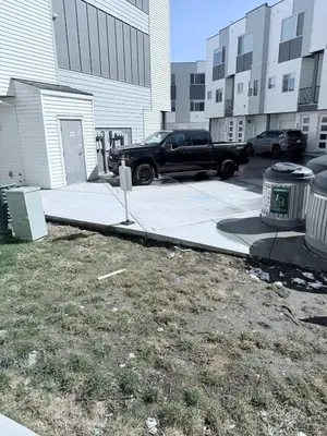 a truck parked in a parking lot next to a building at Cozy Private Room Near Calgary Airport with Parking in Calgary