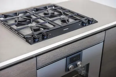 a stove top oven sitting on top of a kitchen counter at Brand New Luxury 1 bedroom Condo in Downtown Vancouver in Vancouver