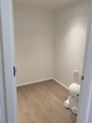 a white stuffed animal sitting in the corner of a room at Brand New Luxury 1 bedroom Condo in Downtown Vancouver in Vancouver