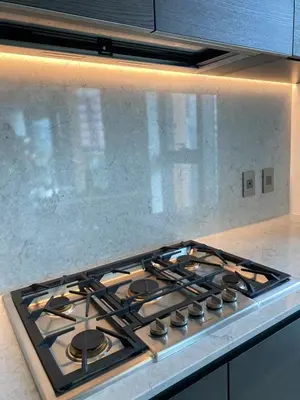a stove top oven sitting in a kitchen at Brand New Modern 2 BR Condo in Heart of Downtown Vancouver in Vancouver