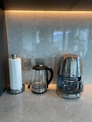 a coffee maker and a toaster on a counter at Brand New Modern 2 BR Condo in Heart of Downtown Vancouver in Vancouver