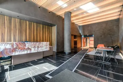 a room with a bed and a desk and a table at Brand New Modern 2 BR Condo in Heart of Downtown Vancouver in Vancouver
