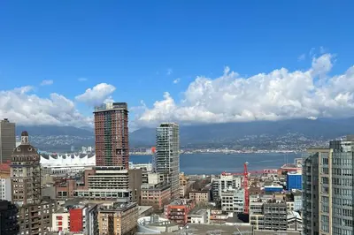 a view of a city with buildings and the water at Executive Unit with Spectacular Views in Vancouver