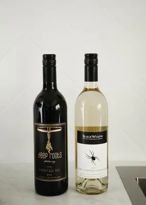 two bottles of wine sitting next to each other at Naramata Courtyard Suites in Naramata