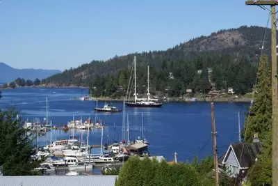 a group of boats docked in a harbor at Enchanter Ocean View Suites in Madeira Park
