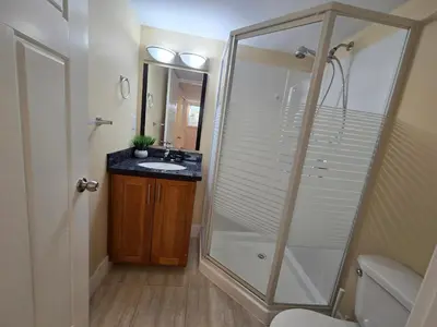 a bathroom with a shower and a sink at The open nest in Delta