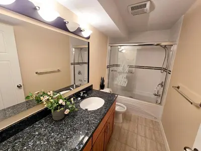 a bathroom with a sink and a shower and a toilet at The open nest in Delta