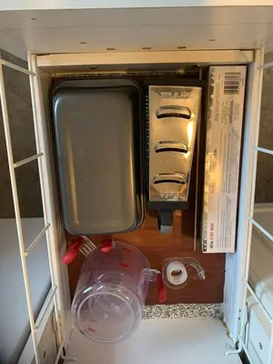 a drawer in a refrigerator filled with various items at Entire Cordwood House 5 minutes south of town in Golden