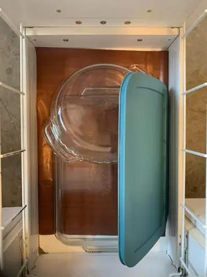 a refrigerator with its door open in a room at Entire Cordwood House 5 minutes south of town in Golden