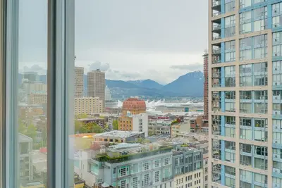 a view from a window of a city with buildings at Gorgeous Unit with Beautiful City Views in Vancouver