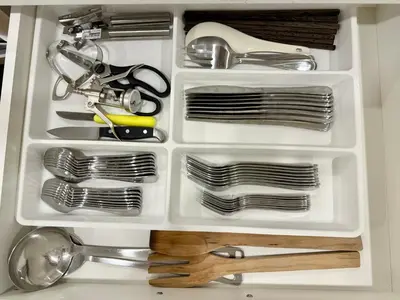 a white drawer filled with dishes and utensils at Vancouver Lake City Way Guesthouse 10 min to SkyTrain in Burnaby