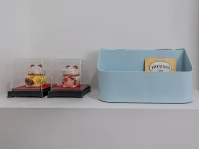 two boxes of hello kitty figurines sitting on a shelf at Quiet, cozy 2BR1BA private entry suite near Skytrain in Vancouver