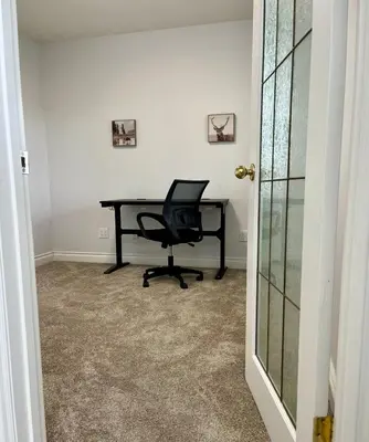 an office with a desk and a chair in a room at Acreage, 5 bdrm, King Bed, AC, Wood Fireplace, Rural in Balzac