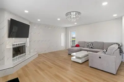 a living room with a couch and a fireplace at Acreage, 5 bdrm, King Bed, AC, Wood Fireplace, Rural in Balzac