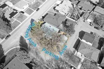 an overhead view of a street with trees and buildings at Quiet Family Friendly, 4 min UofC and University District Shops, 9 min DT in Calgary