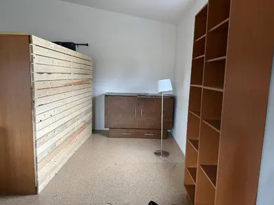 a room with a closet with a desk and a book shelf at Mezzanine Loft Above the Barn in Whitehorse