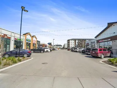 a parking lot with cars parked in a city at Deluxe 2-Bedroom Getaway Near Calgary Airport Sleeps Up to 6 in Calgary