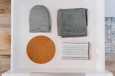 a display case with towels and other items on a wall at Roamer's Nook in Nordegg