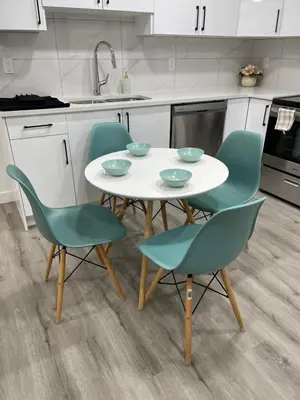 a kitchen with a white table and four chairs at Comfy 2 Bedroom Suite Getaway in Edmonton