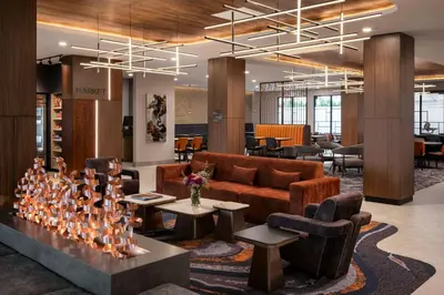 a lobby with a couch and chairs and tables at Fairfield Inn & Suites by Marriott Chilliwack in Chilliwack