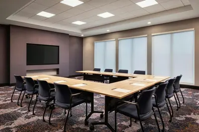 a conference room with a large wooden table and chairs at Fairfield Inn & Suites by Marriott Chilliwack in Chilliwack