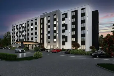 a rendering of a building with cars parked in a parking lot at TownePlace Suites by Marriott Chilliwack in Chilliwack